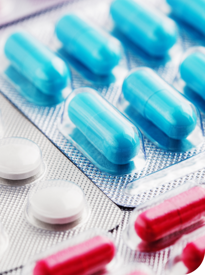 Blue capsules, red capsules and white tablets in blister packaging